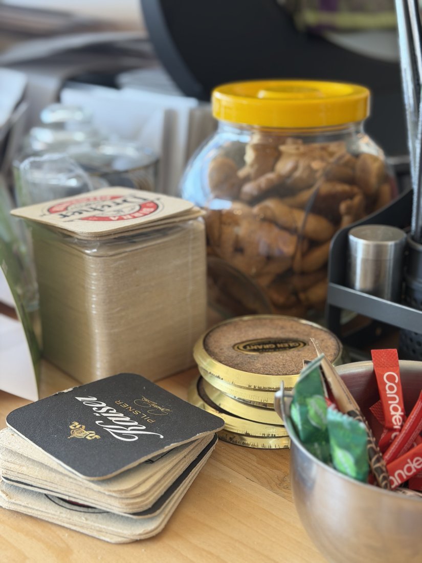 Coasters, cookie jar and bar details on the counter